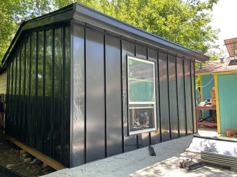 Black standing seam metal wall panels for Roof Inspection in Fresno